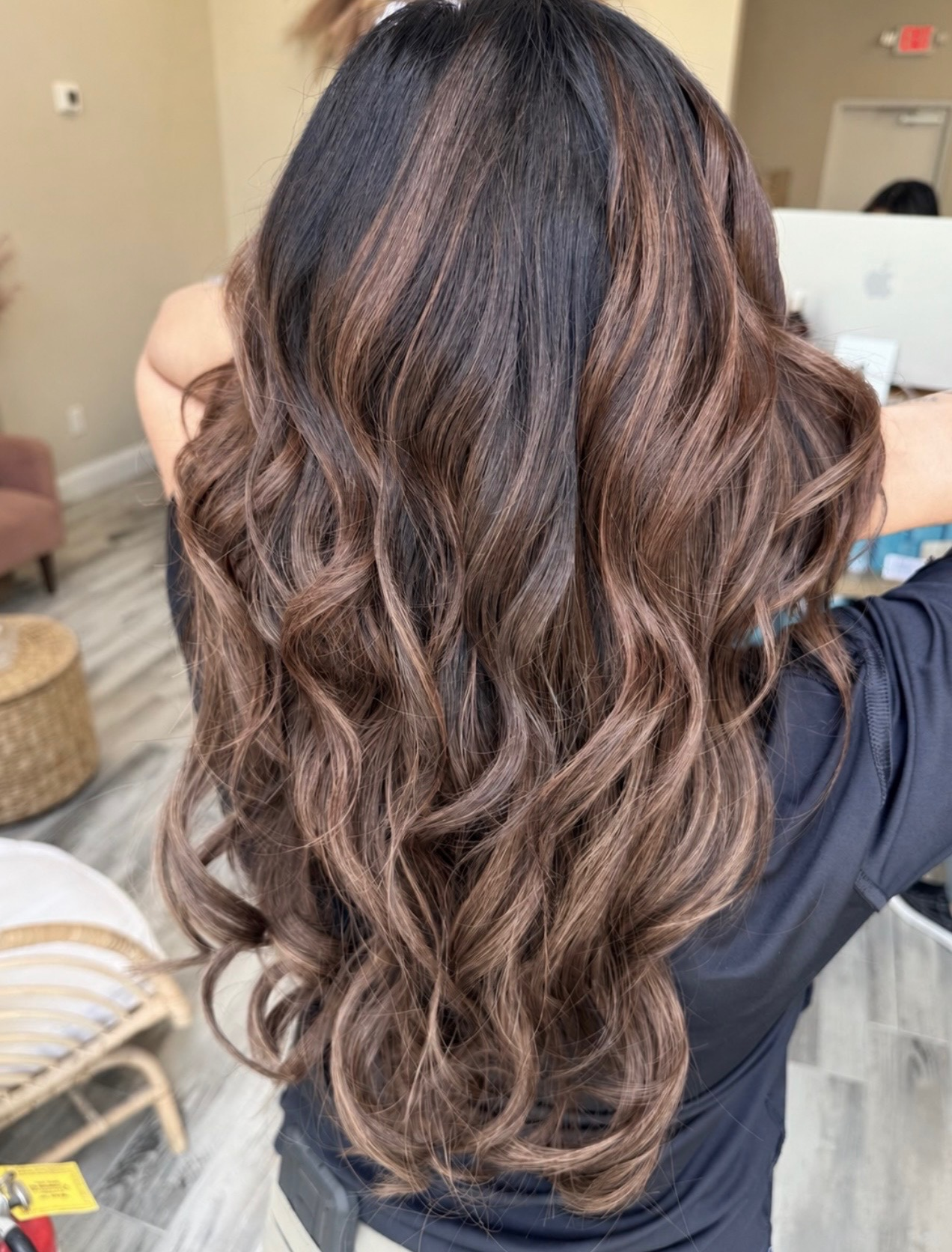 K-tip keratin bonds being applied to brown hair